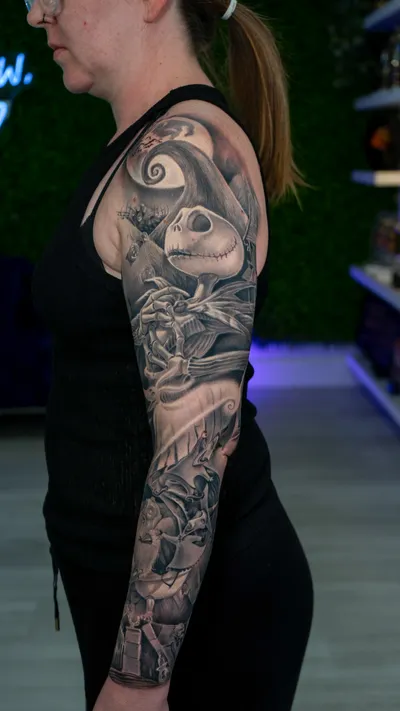 Hyper-realistic portrait tattoo in black and grey